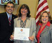 Homestead Job Corps Business and Community Liaison Lesly Diaz, center, receives Certificate of Special Congressional Recognition from U.S. Rep. David Rivera, left, and U.S. Rep. Ileana Ros-Lehtinen.