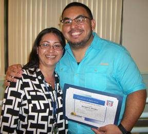 Homestead Job Corps Center graduate Benjamin Borges received a certificate of appreciation while visiting his mother, Testing Specialist Kathia Lounsbury.