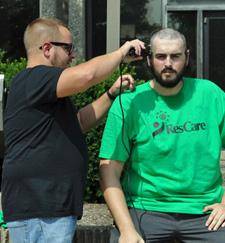 Systems Security Manager Justin Watson was honored to give Plane Pull team member, User Hardware Analyst Josh Selter, the final touches to his new haircut.