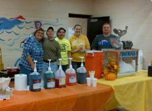 The core management team at Outwood served fellow staff snow cones during an appreciation celebration.